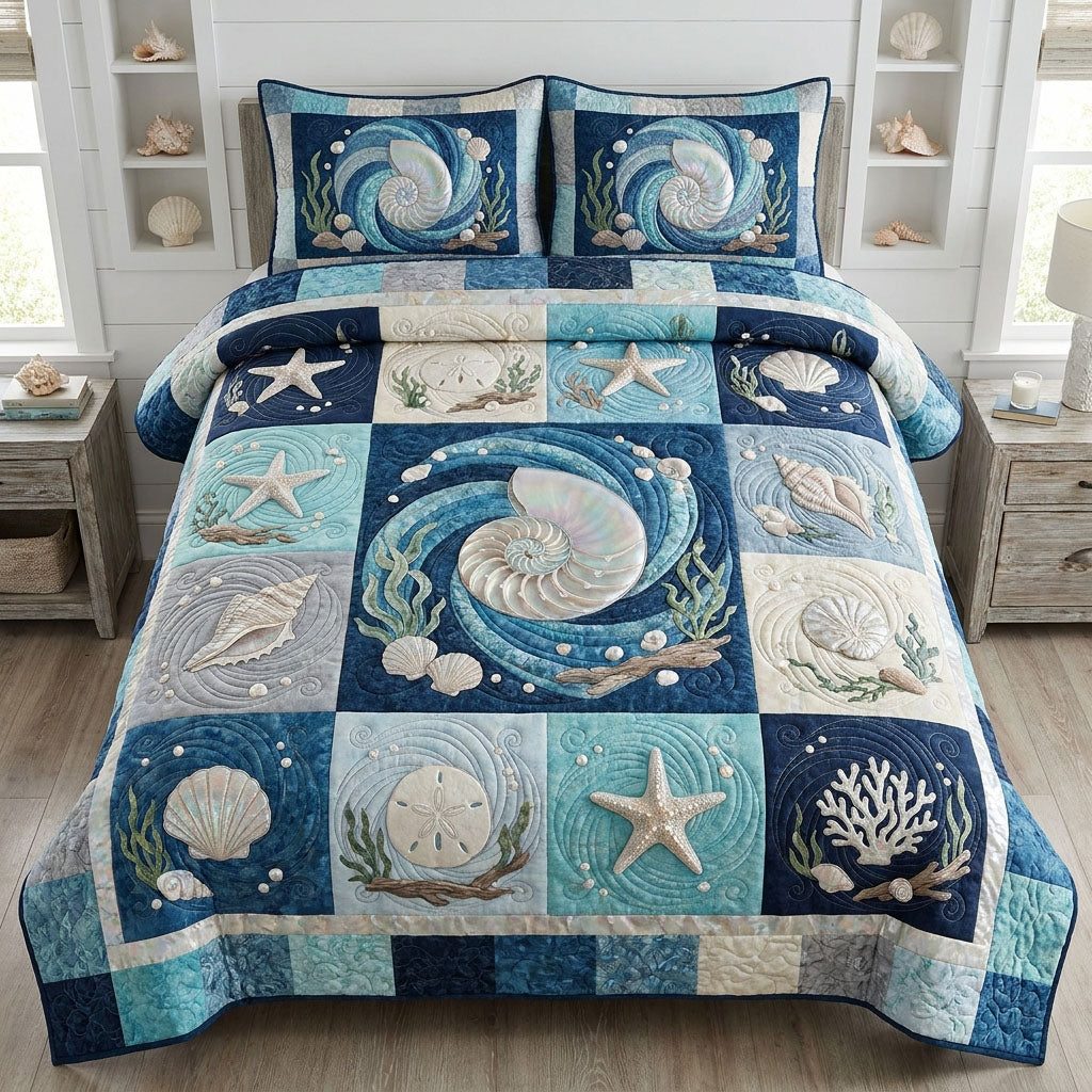 The Coastal Passage quilted 3-piece bedding set on a made bed in a light coastal bedroom