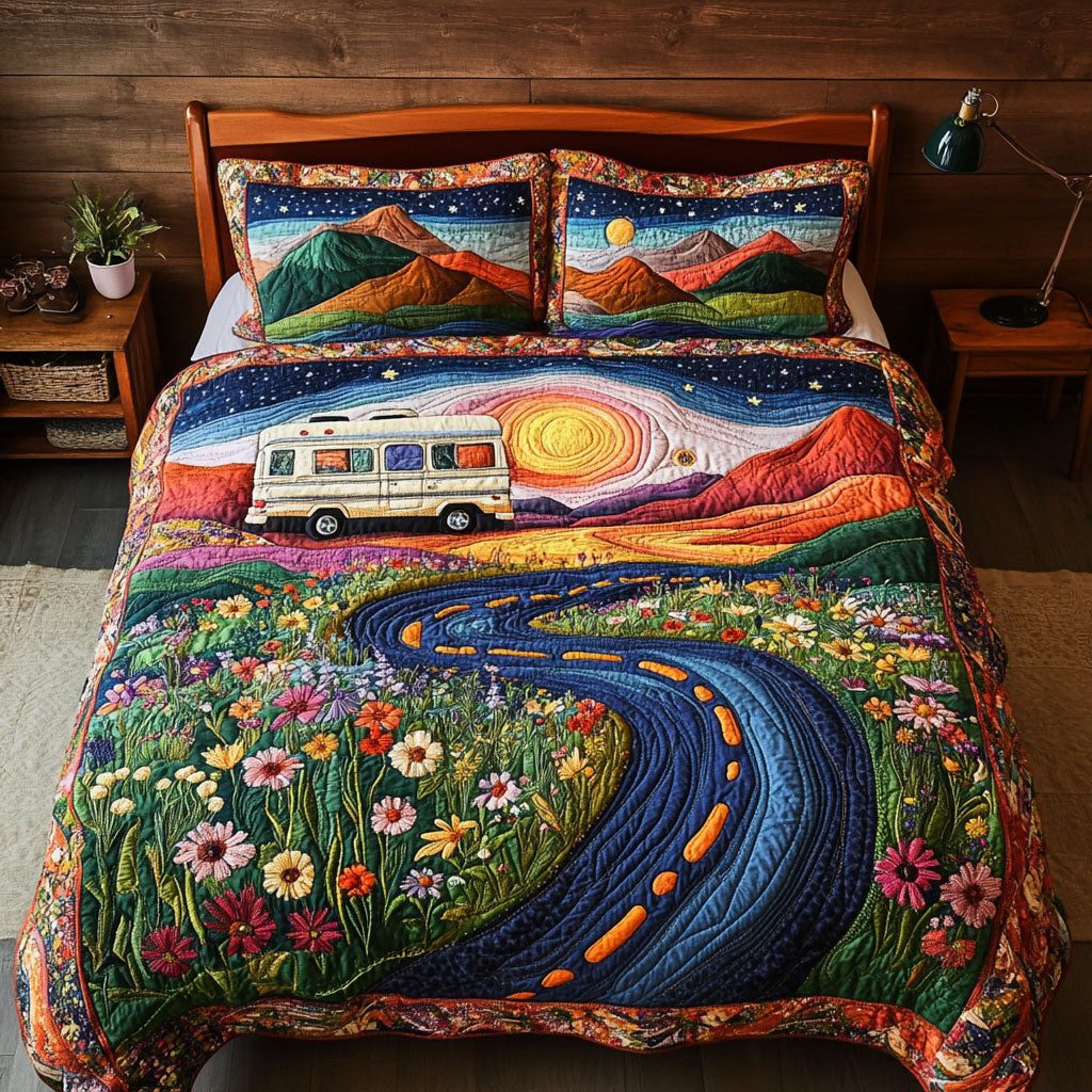 The Open Road quilted 3-piece bedding set on a made bed with two matching pillow shams
