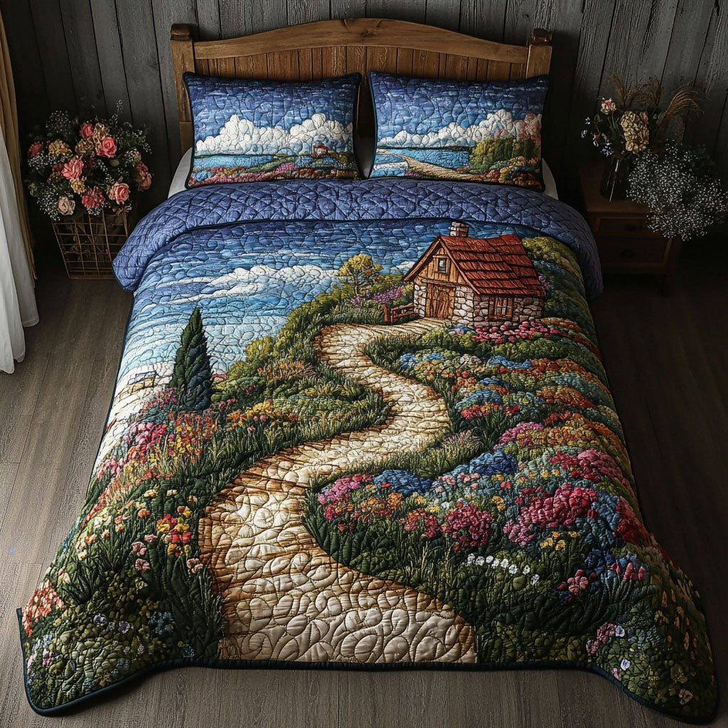 The Road Home quilted 3-piece bedding set on a made bed with two matching pillow shams