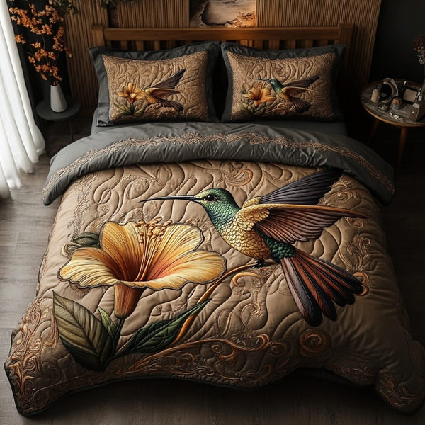 Timeless Hummingbird quilted 3-piece bedding set on a made bed in a farmhouse bedroom