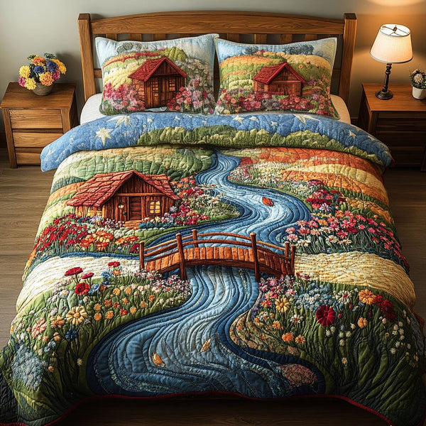 Tranquil Blooming Fields quilted 3-piece bedding set on a made bed with two matching pillow shams