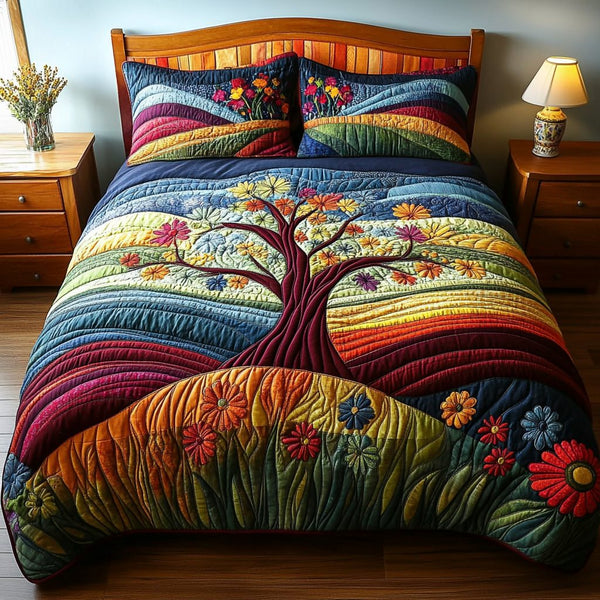 Tree Dreamscape quilted 3-piece bedding set on a made bed with two matching pillow shams