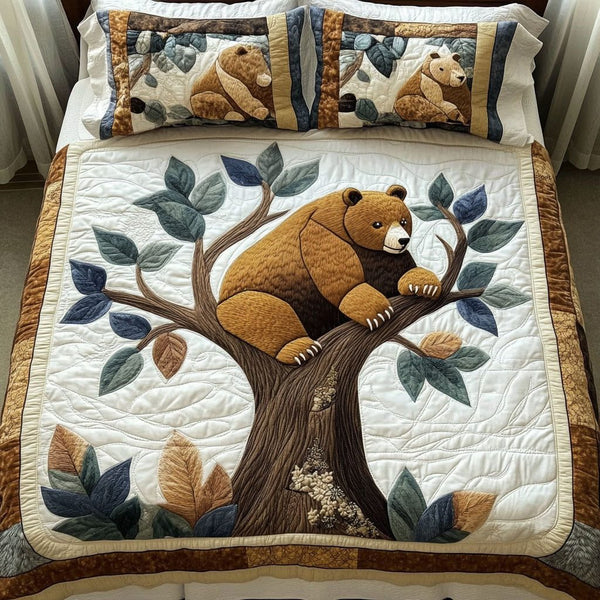 Tree Hugger quilted 3-piece bedding set on a made bed with two matching pillow shams