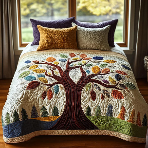 Tree Of Life quilted 3-piece bedding set on a made bed with two matching pillow shams
