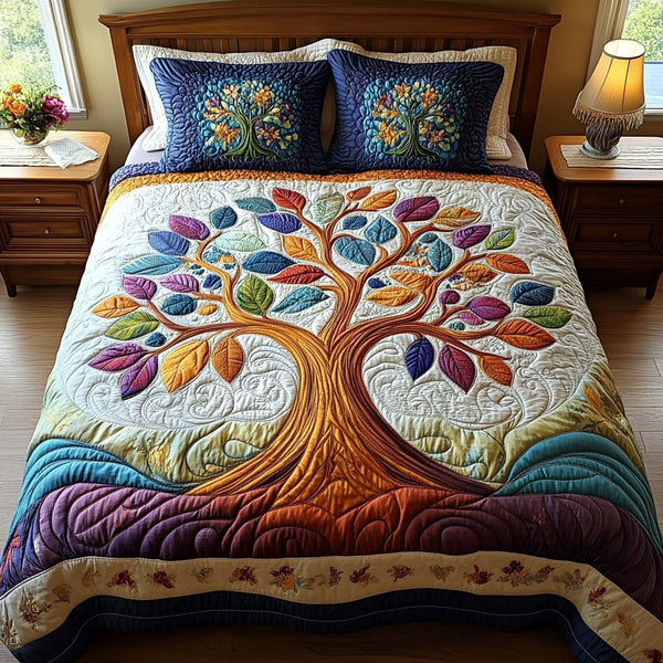 Tree of Life quilted 3-piece bedding set on a made bed with two matching pillow shams
