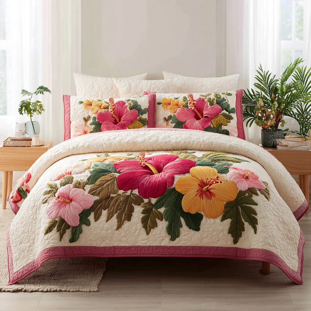 Tropical Bloom quilted 3-piece bedding set on a made bed in a light coastal bedroom