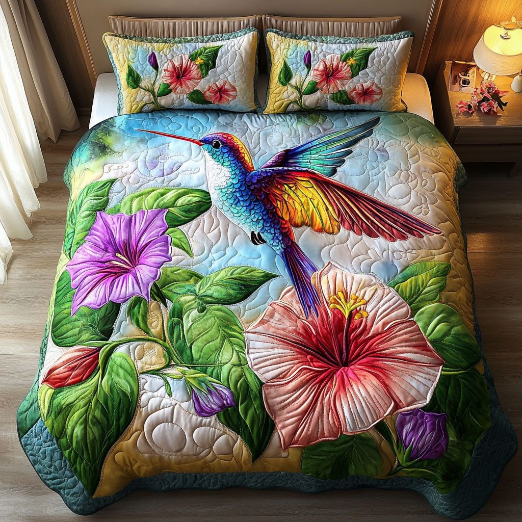 Tropical Hummingbird quilted 3-piece bedding set on a made bed in a light coastal bedroom