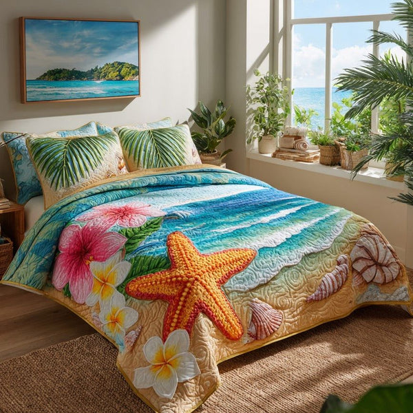 Tropical Starfish quilted 3-piece bedding set on a made bed in a light coastal bedroom