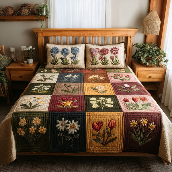 Tulip Bloom quilted 3-piece bedding set on a made bed with two matching pillow shams