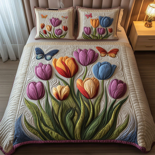 Tulip Paradise quilted 3-piece bedding set on a made bed with two matching pillow shams