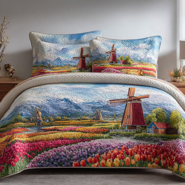 Tulip Windmill quilted 3-piece bedding set on a made bed with two matching pillow shams