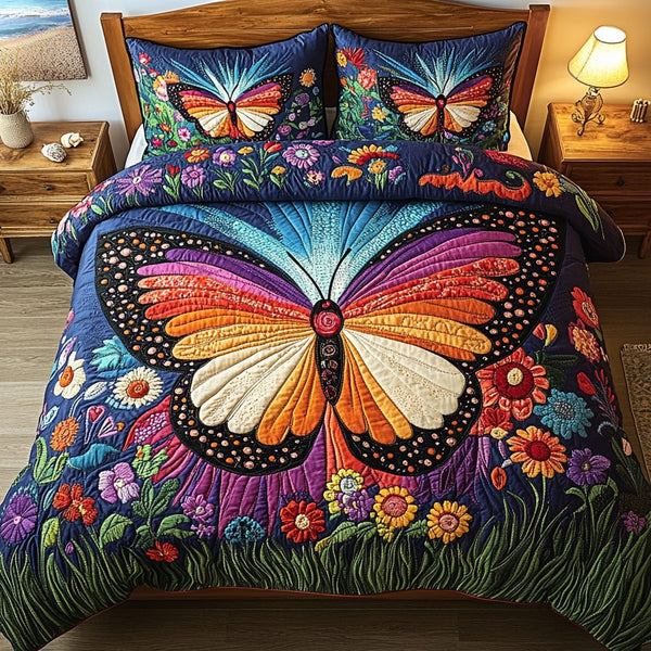 Twilight Bloom quilted 3-piece bedding set on a made bed with two matching pillow shams