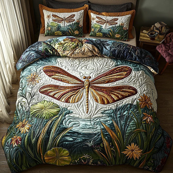 Twilight Dragonfly quilted 3-piece bedding set on a made bed with two matching pillow shams