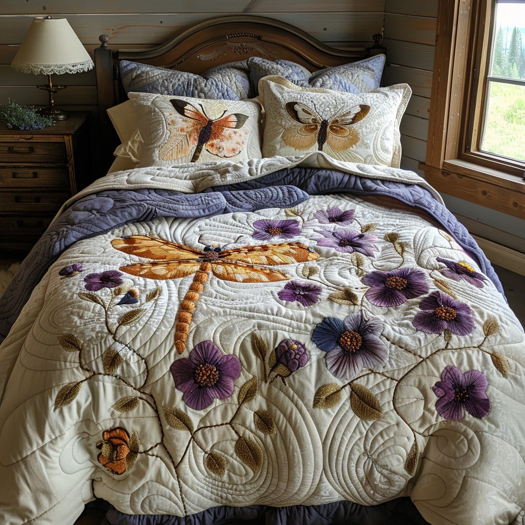 Twilight Dragonfly quilted 3-piece bedding set on a made bed with two matching pillow shams