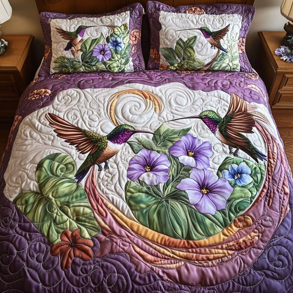 Twilight Whispers quilted 3-piece bedding set on a made bed with two matching pillow shams