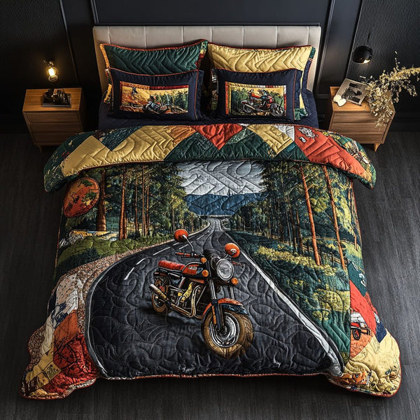Two-Wheeled Journey quilted 3-piece bedding set on a made bed with two matching pillow shams