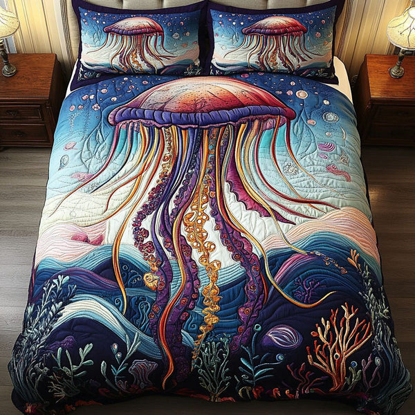 Underwater Dreams quilted 3-piece bedding set on a made bed with two matching pillow shams