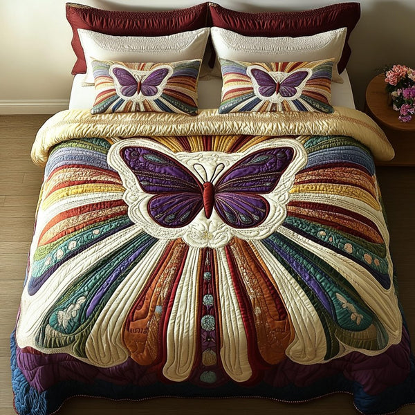 Velvet Monarch quilted 3-piece bedding set on a made bed with two matching pillow shams