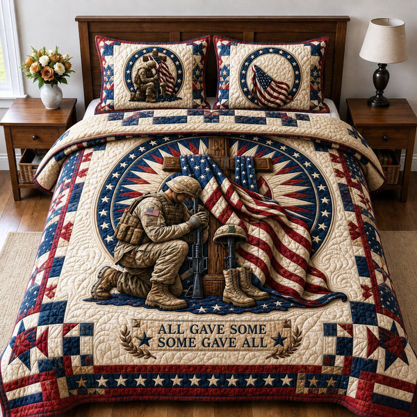 Veterans True Honor quilted 3-piece bedding set on a made bed in a warmly lit bedroom