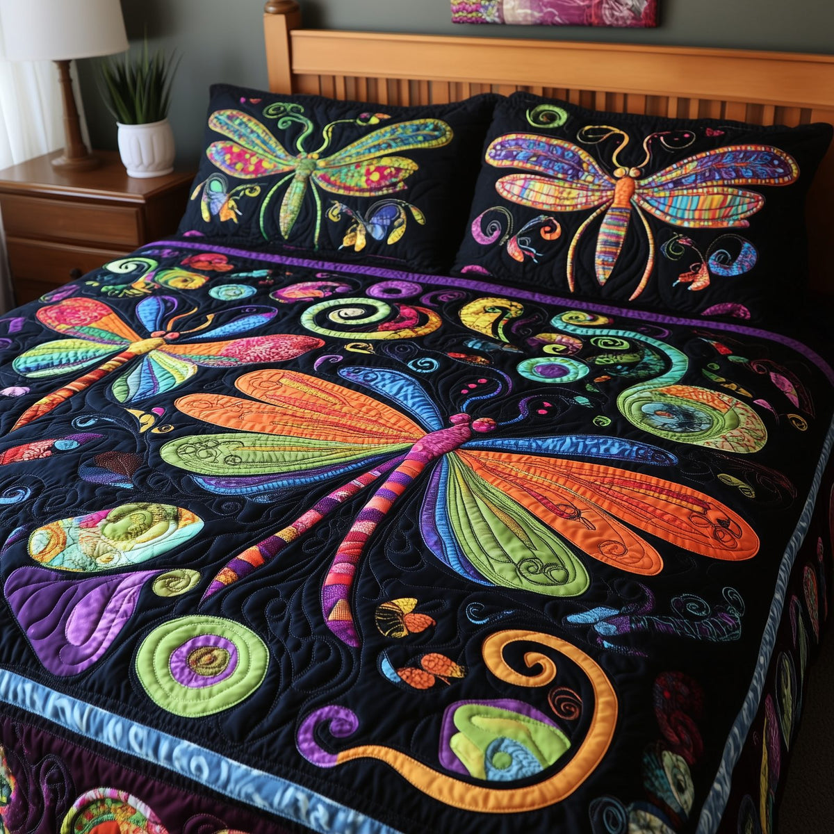 Vibrant Dragonfly quilted 3-piece bedding set on a made bed with two matching pillow shams