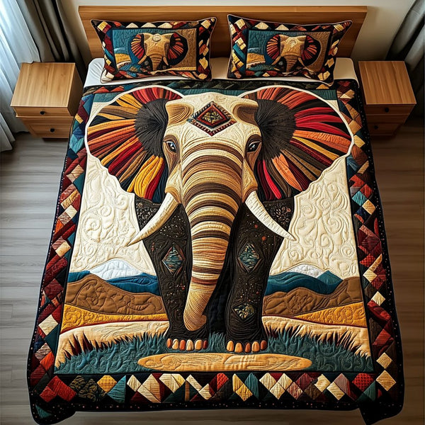 Vibrant Elegance quilted 3-piece bedding set on a made bed with two matching pillow shams