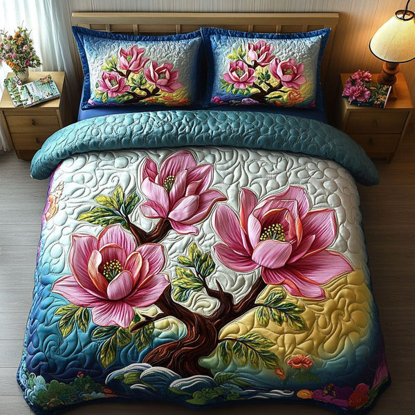 Vibrant Pink Blossoms quilted 3-piece bedding set on a made bed with two matching pillow shams