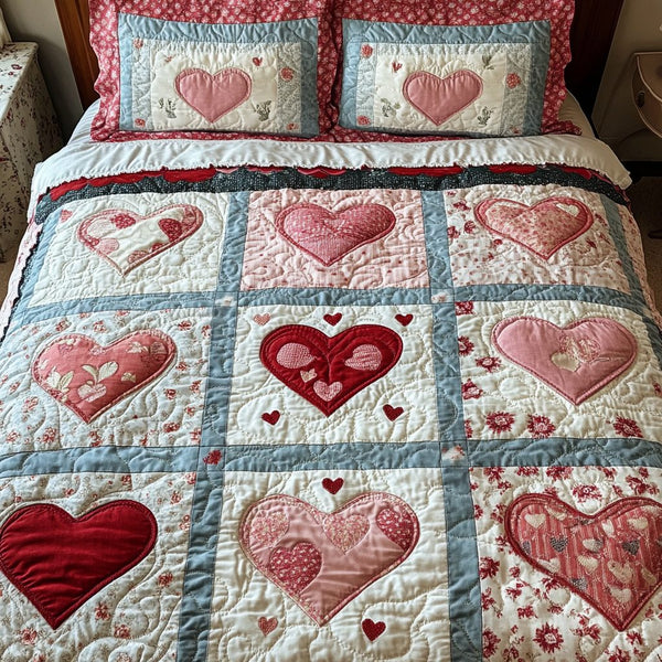 Vintage Heart Charm quilted 3-piece bedding set on a made bed in a farmhouse bedroom