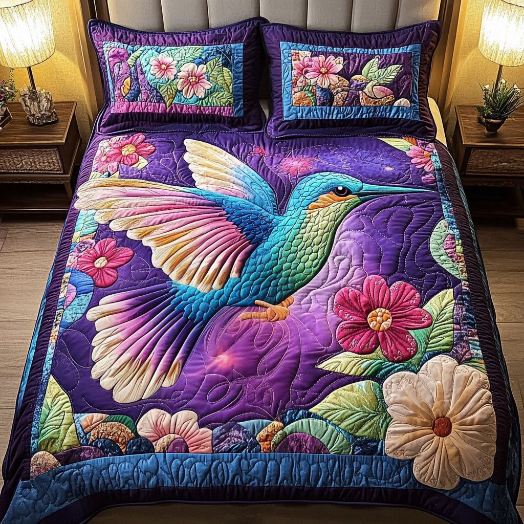 Violet Grace quilted 3-piece bedding set on a made bed with two matching pillow shams