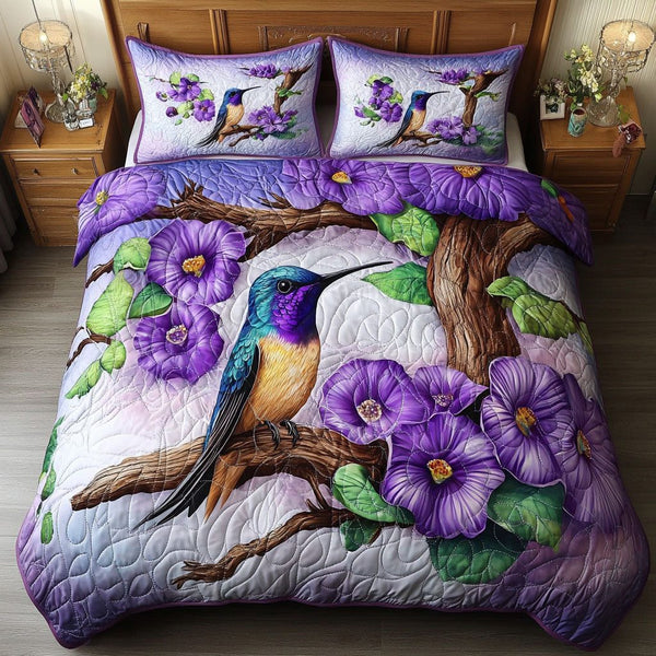 Violet Serenity quilted 3-piece bedding set on a made bed with two matching pillow shams