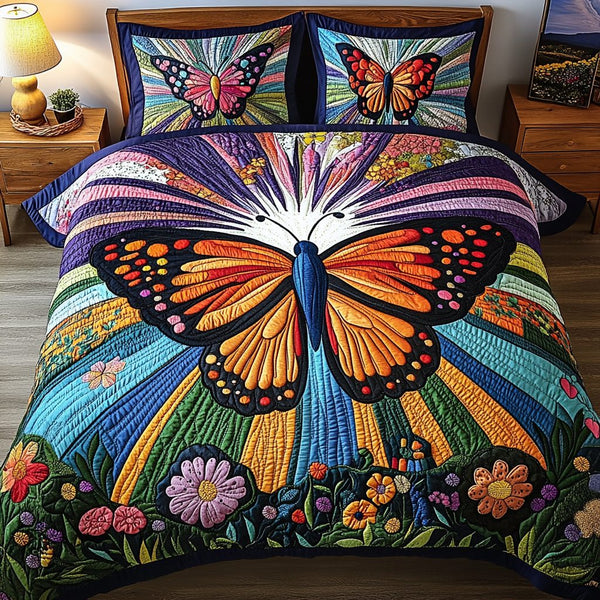 Vivid Flight quilted 3-piece bedding set on a made bed with two matching pillow shams