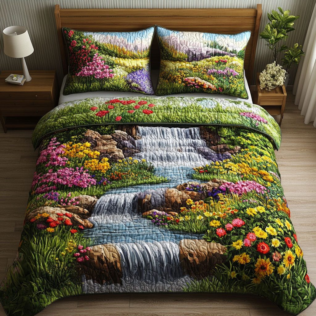 Waterfall Garden Bliss quilted 3-piece bedding set on a made bed with two matching pillow shams