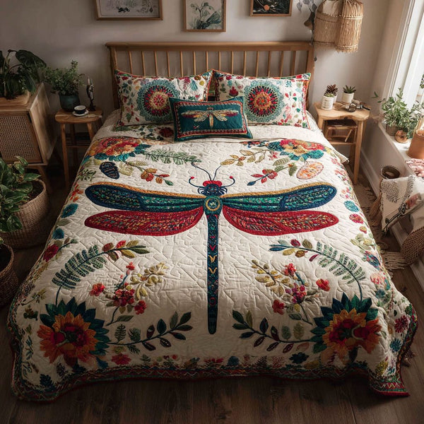 Whimsy in Flight quilted 3-piece bedding set on a made bed with two matching pillow shams