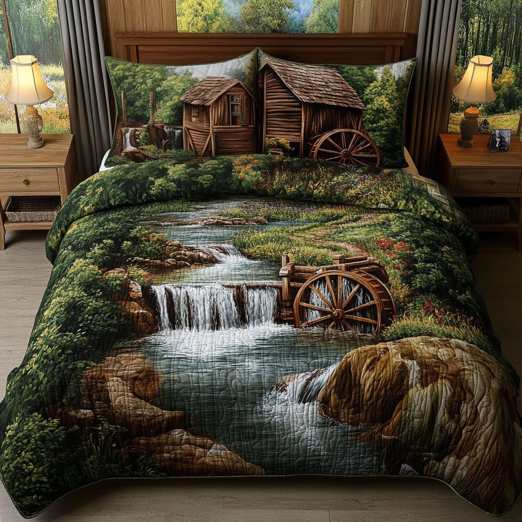Whispering Falls quilted 3-piece bedding set on a made bed with two matching pillow shams