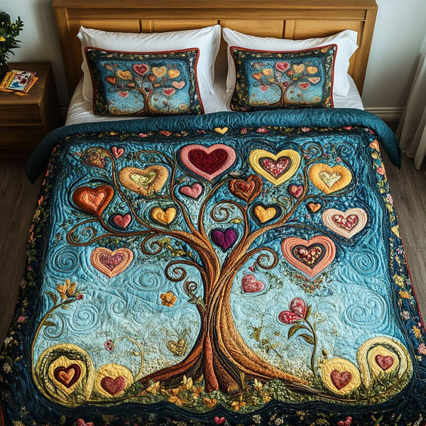 Whispering Leaves quilted 3-piece bedding set on a made bed with two matching pillow shams