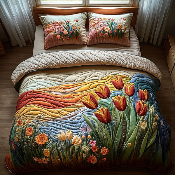 Whispering Petals quilted 3-piece bedding set on a made bed with two matching pillow shams