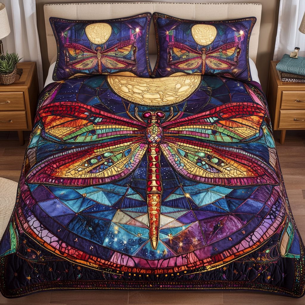 Whispering Wings quilted 3-piece bedding set on a made bed with two matching pillow shams