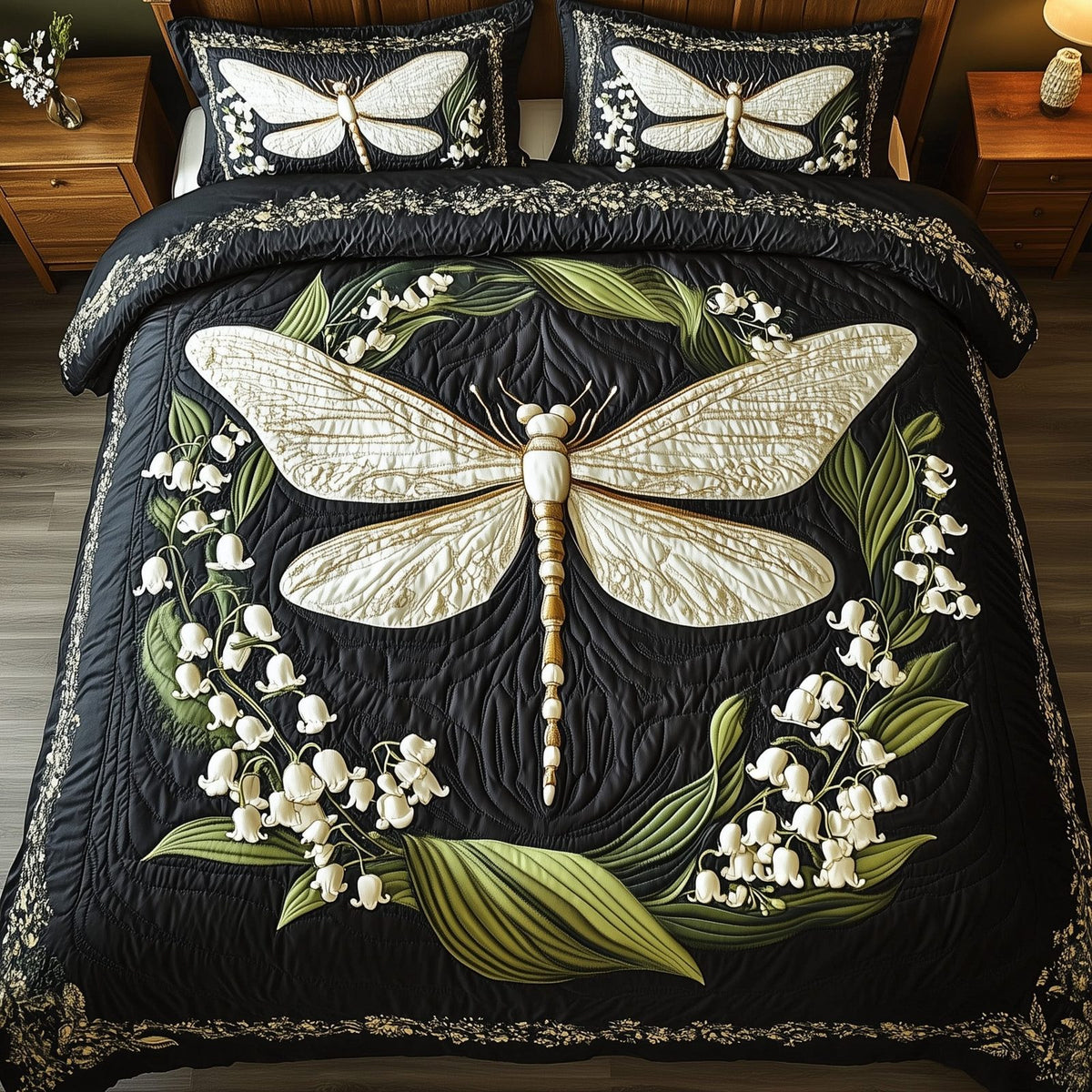Whispers of the Valley quilted 3-piece bedding set on a made bed with two matching pillow shams