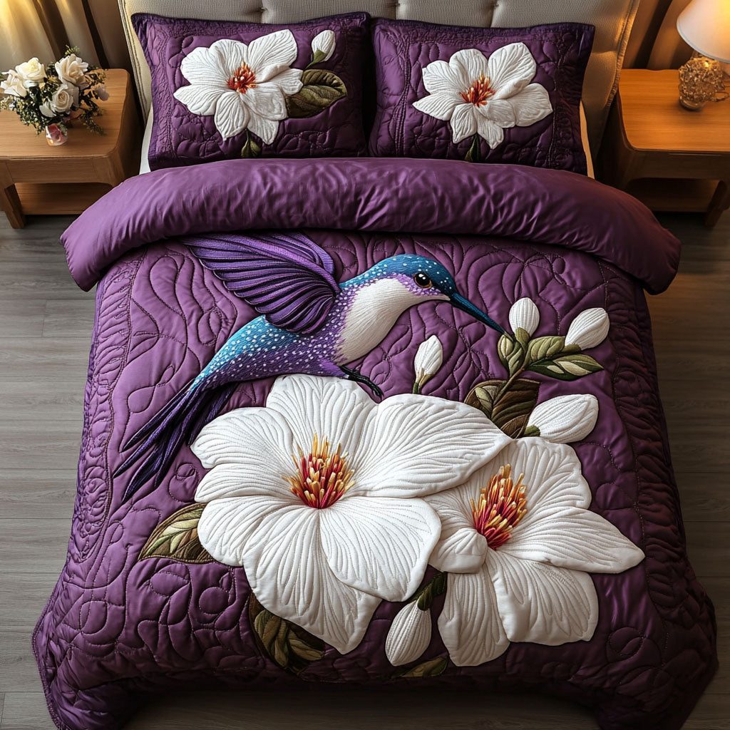 White Blooming Flight quilted 3-piece bedding set on a made bed with two matching pillow shams