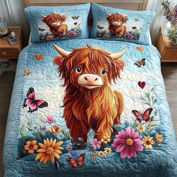 Wildflower Moo quilted 3-piece bedding set on a made bed with two matching pillow shams