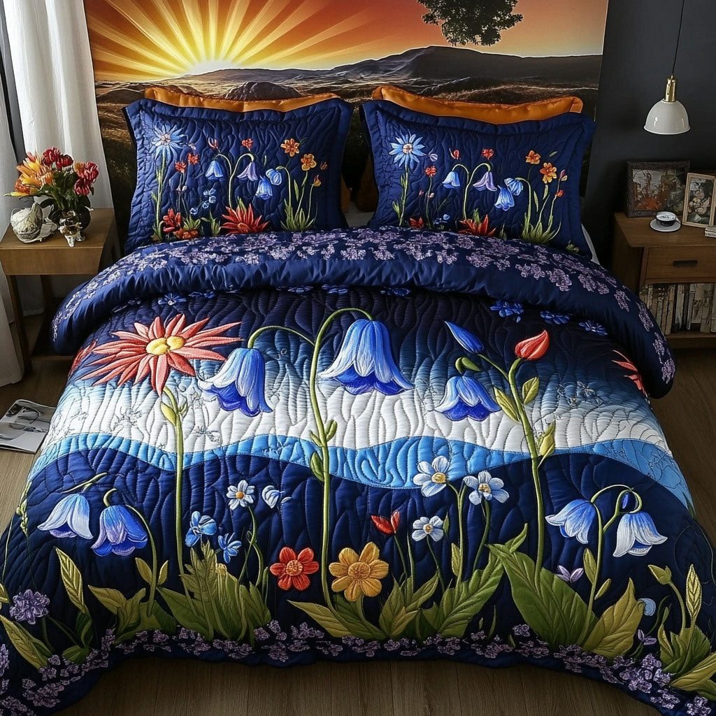 Wildflower Serenade quilted 3-piece bedding set on a made bed with two matching pillow shams