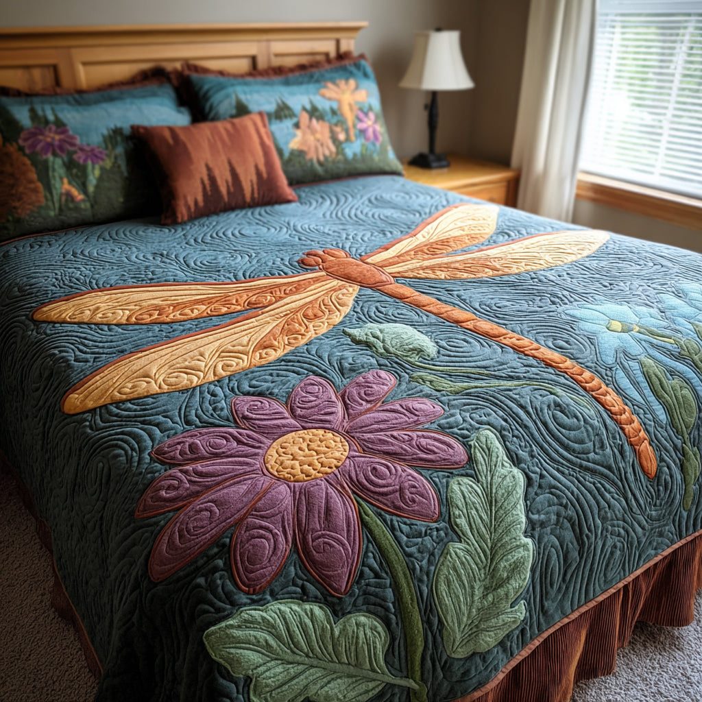 Winged Harmony quilted 3-piece bedding set on a made bed with two matching pillow shams
