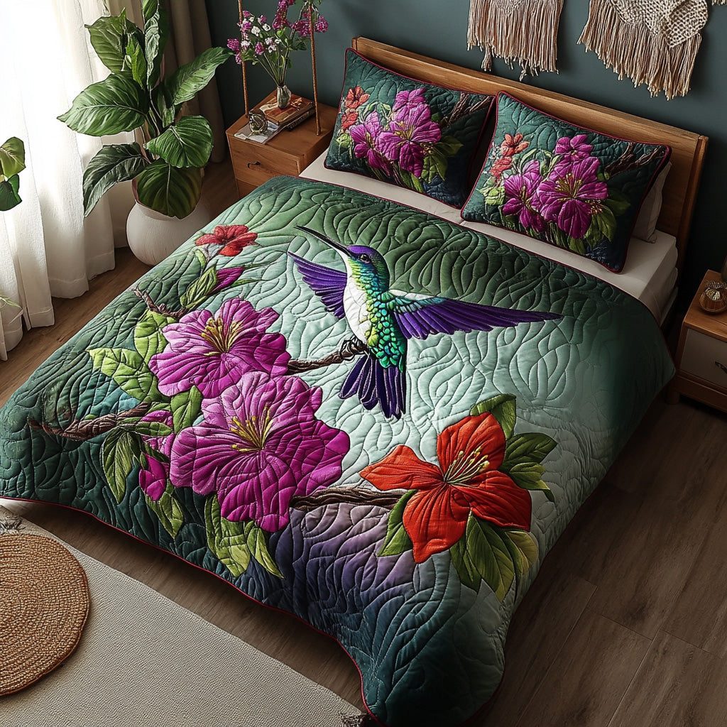 Winged Joy quilted 3-piece bedding set on a made bed with two matching pillow shams