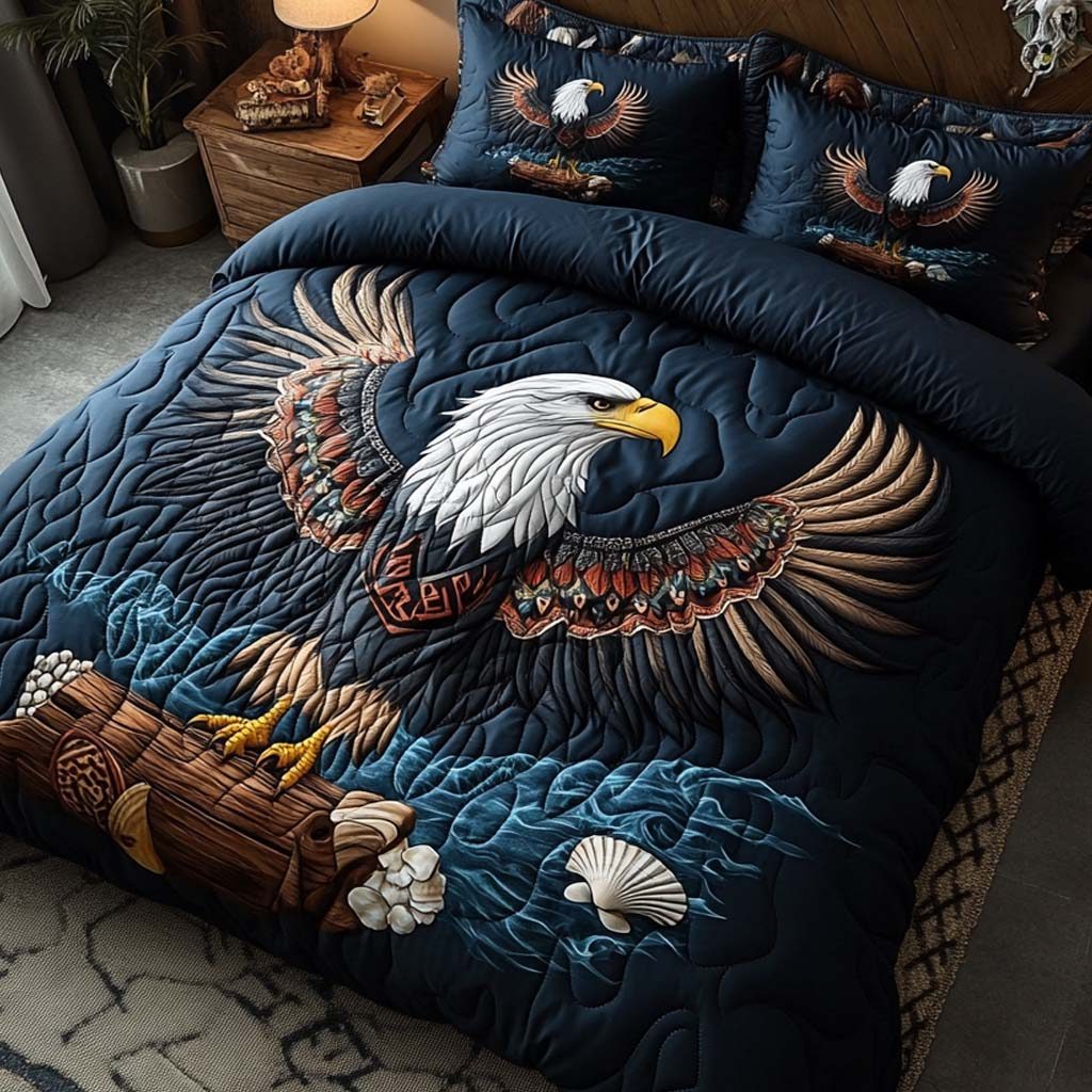 Wings of Freedom quilted 3-piece bedding set on a made bed in a warmly lit bedroom