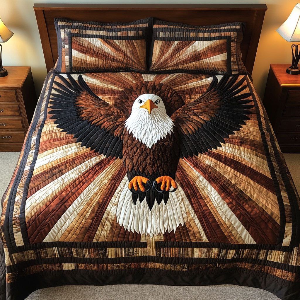 Wings of Power quilted 3-piece bedding set on a made bed with two matching pillow shams