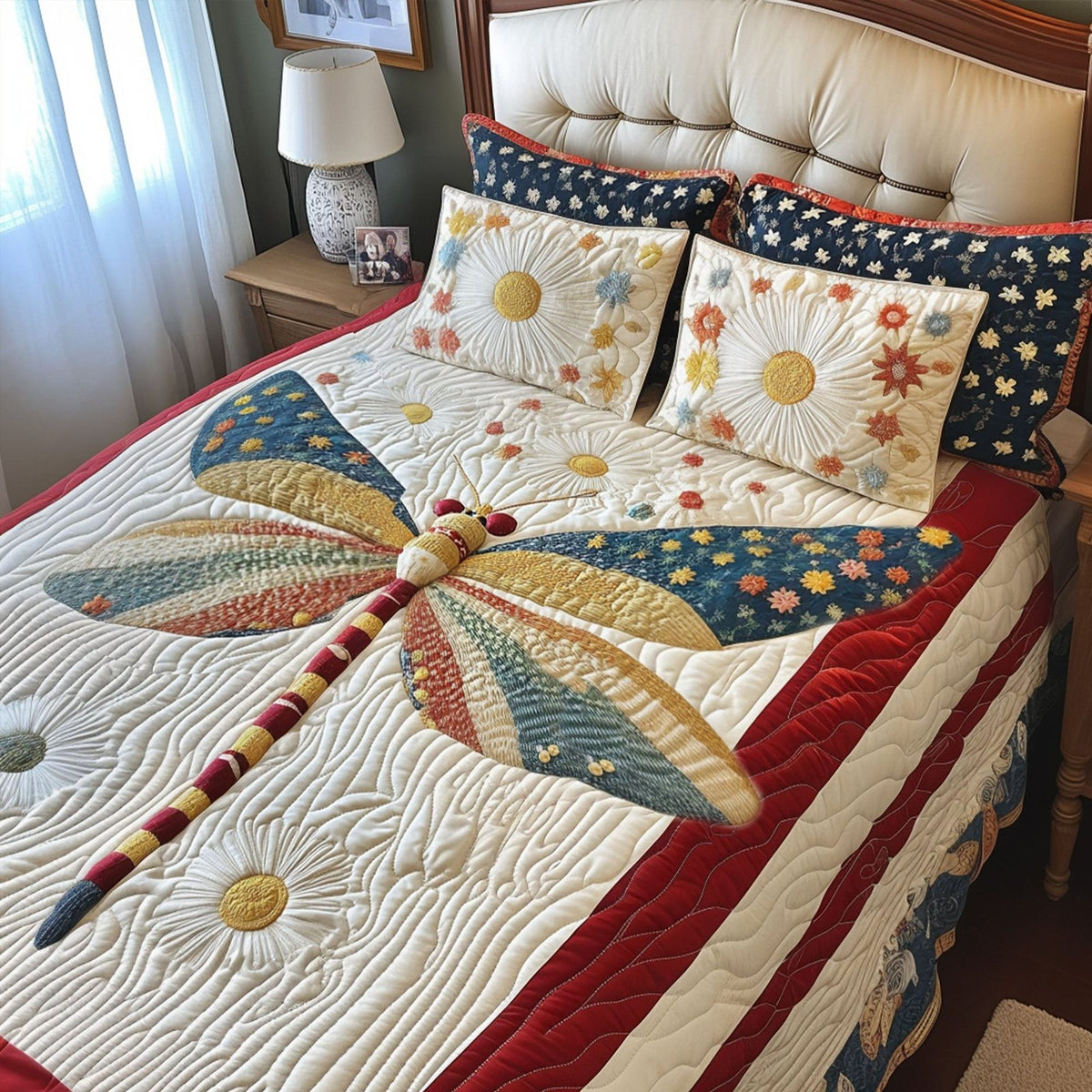 Wings of Pride quilted 3-piece bedding set on a made bed with two matching pillow shams