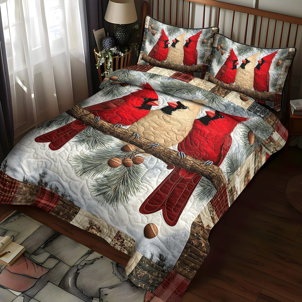 Woodland Cardinals quilted 3-piece bedding set on a made bed with two matching pillow shams
