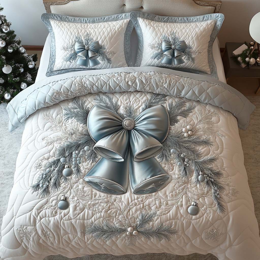 Yuletide Bell Glow quilted 3-piece bedding set on a made bed with two matching pillow shams