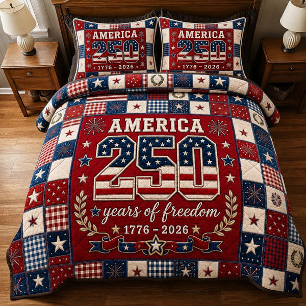 America 250 Freedom quilted 3-piece bedding set on a made bed in a warmly lit bedroom