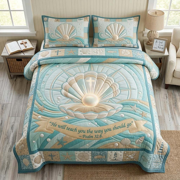 Coastal Blessing quilted 3-piece bedding set on a made bed in a light coastal bedroom