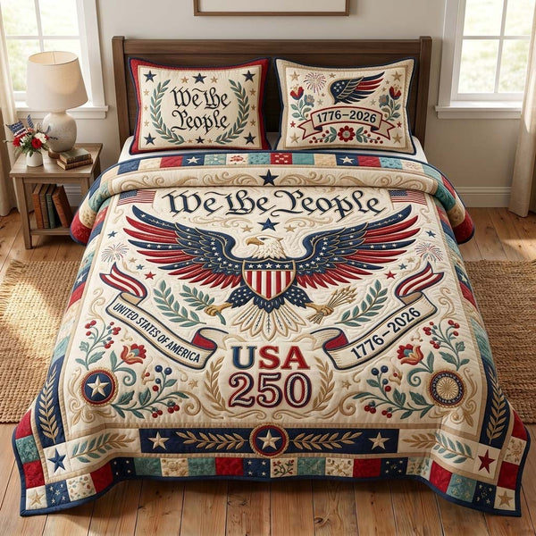 America Legacy quilted 3-piece bedding set on a made bed in a warmly lit bedroom